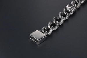 Macro detail of retro steel chain bracelet with intricate vintage floral carvings
