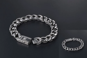 Detailed view of silver titanium steel Cuban link bracelet with engraved rectangular clasp