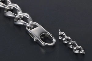 Macro shot of durable stainless steel lobster clasp and thick curb chain link detail
