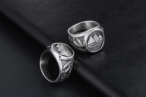 Detailed relief of Egyptian pyramids and palm trees on a silver titanium steel ring