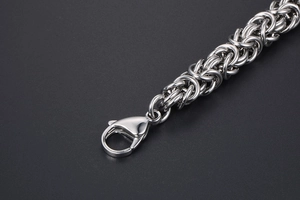 Macro shot of silver Byzantine chain with a lobster clasp closure for men