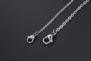 Macro view of S925 sterling silver O-chain ends with secure lobster clasp closures