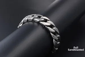 Macro view of matte frosted cuban link chain bracelet with industrial steel finish