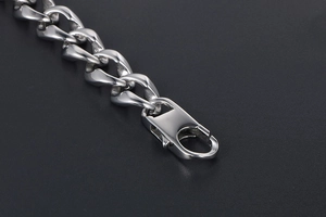 Detail shot of the silver titanium steel curb chain bracelet with a secure lobster clasp