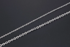 Macro detail of polished stainless steel O-chain links in two different widths