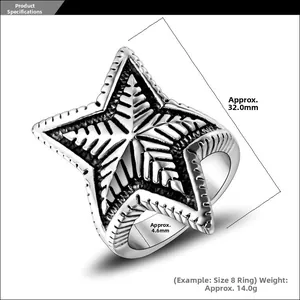 Macro view of vintage oversized star ring with oxidized finish and geometric textures