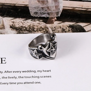 Vintage stainless steel pentagram ring with black oxidation for a punk aesthetic