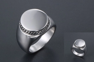 Close-up of wide silver titanium steel signet ring with detailed rope texture edge