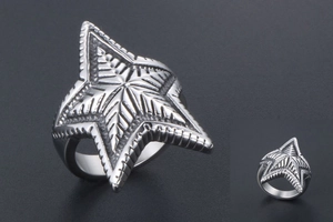 Macro detail of silver star ring showing radial line texture and metallic finish