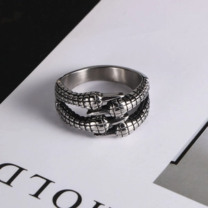 Macro shot of retro stainless steel dragon claw ring with textured silver finish