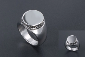 Detail of silver signet ring with rope texture edge and polished wide band