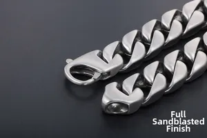 Macro detail of industrial Cuban link bracelet with a premium matte silver finish