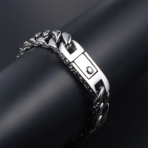 Polished titanium steel Cuban link bracelet with industrial U-shaped buckle on black stand