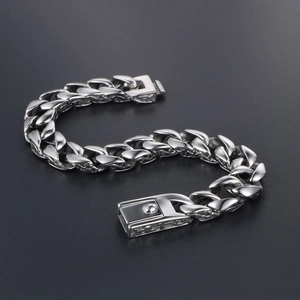 Polished silver titanium steel cuban link bracelet with detailed side engraving for men