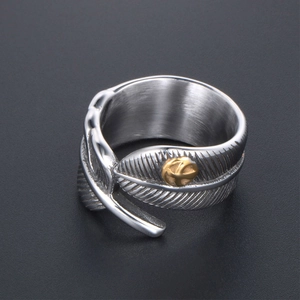Vintage oxidized silver feather ring with gold eagle emblem and adjustable open band