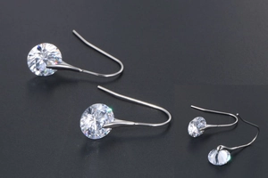 Detailed view of round brilliant-cut crystal earrings with classic hook drop design