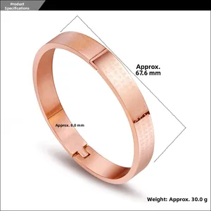 Macro shot of rose gold titanium steel bracelet showing laser engraved Chinese scriptures