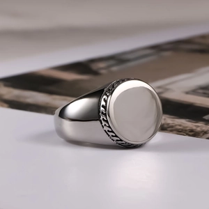 Polished titanium steel signet ring for men with woven textured relief on the side edges