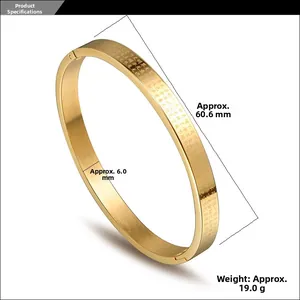 Detailed macro view of gold titanium steel bangle showing engraved scriptures and dimensions
