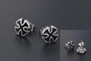 Macro detail of titanium steel cross stud earrings with black drip oil finish and silver edge