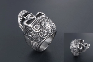Macro shot of steampunk skull ring with mechanical gear details and vintage finish