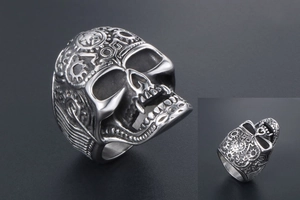 Detailed close-up of punk skull ring featuring steampunk mechanical gears and stars