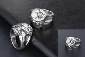 Macro detail of men's skull ring in silver stainless steel with engraved cross pattern