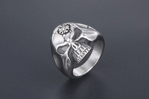 Detailed view of retro stainless steel skull ring with embossed cross pattern on forehead