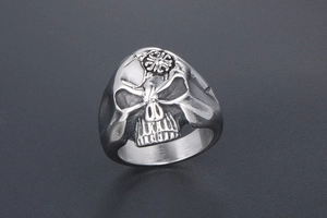 Macro detail of gothic skull ring in vintage silver finish with engraved forehead cross