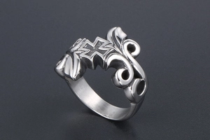 Detailed view of vintage titanium steel ring with gothic cross and vine leaf engravings