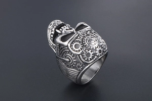 Macro detail of gothic skull ring featuring mechanical gears and steampunk industrial textures