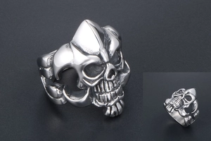 Macro detail of gothic skull ring in vintage silver finish with high-contrast shadows