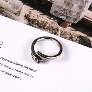 Vintage silver-tone open ring featuring detailed rose relief with an antique finish