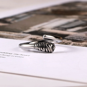 Minimalist silver steel open ring featuring a unique spiral texture and vintage design