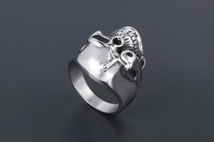 Detailed side view of vintage punk skull ring with intricate steel bone carvings