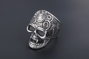 Macro detail of punk skull ring with vintage finish and mechanical gear engravings