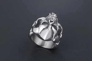 Detailed macro shot of vintage silver skull ring with gothic relief and matte steel texture