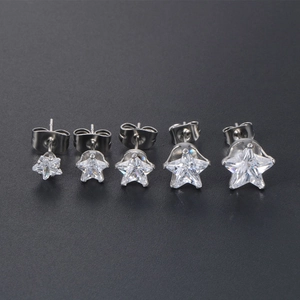 Set of five stainless steel star stud earrings with white zircons in various sizes