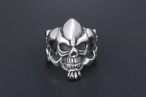 Macro shot of polished titanium steel skull ring with vintage oxidized finish details