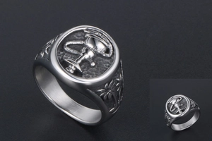 Detailed view of vintage matte steel signet ring featuring trophy and palm tree motifs