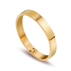 Gold plated stainless steel cuff bracelet with brushed finish and heart sutra engraving