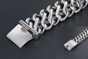 Detailed macro view of the heavy stainless steel Cuban link chain with a box clasp