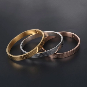 Three-piece stainless steel bracelets in gold, silver, and rose gold with engraved scripture