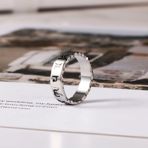 Men's vintage titanium steel ring with hollowed Sanskrit mantra and serrated edges