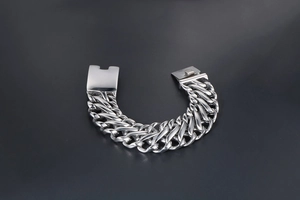 Detailed view of silver Cuban link chain bracelet with a heavy-duty rectangular clasp