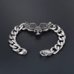 Gothic punk stainless steel bracelet featuring skull and bat wings on heavy cuban chain
