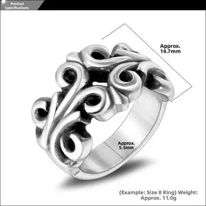 Detail shot showing 14.7mm width and scroll relief engraving on titanium steel ring