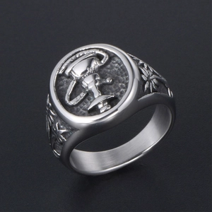 Vintage stainless steel ring with embossed trophy motif and floral side patterns