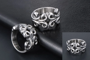 Detailed macro view of vintage titanium steel rings featuring intricate scroll engravings