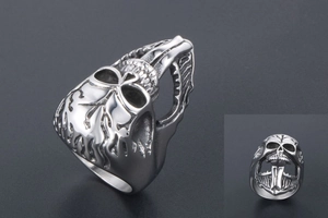 Macro detail of gothic skull ring showing vintage silver finish and oxidized metal texture